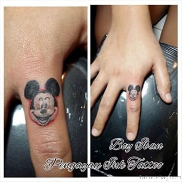 Nice Mickey Face Tattoo On Finger