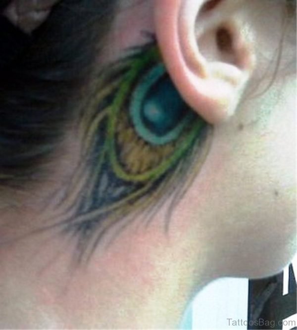 Nice Peacock Feather Tattoo On Neck Behind Ear