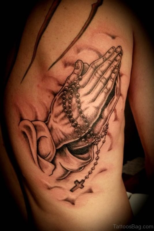 Nice Praying Hands Tattoo On Rib