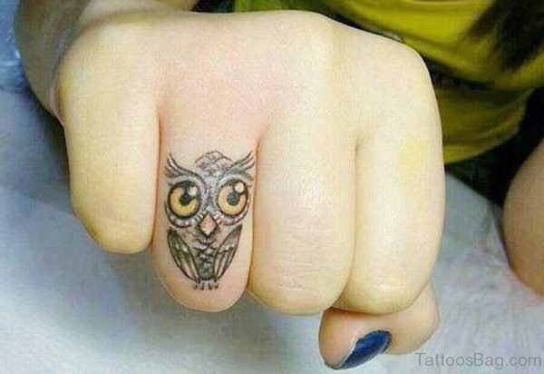 Owl Eyes Tattoo On Finger