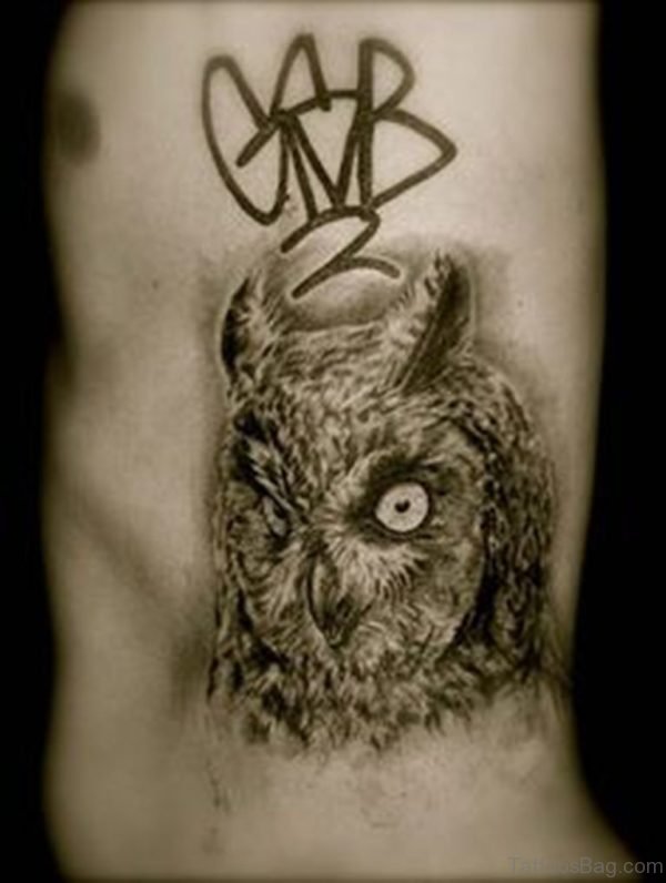 Owl Face Tattoo On Rib
