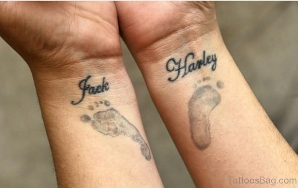 Paw And Word Tattoo On Wrist