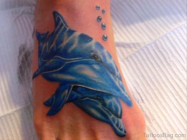 Phenomenal Dolphins Tattoo On Foot