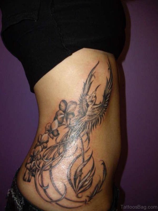 Phoenix And Orchid Rib Tattoo