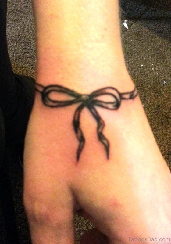 Photo Of Bow Tattoo On Wrist