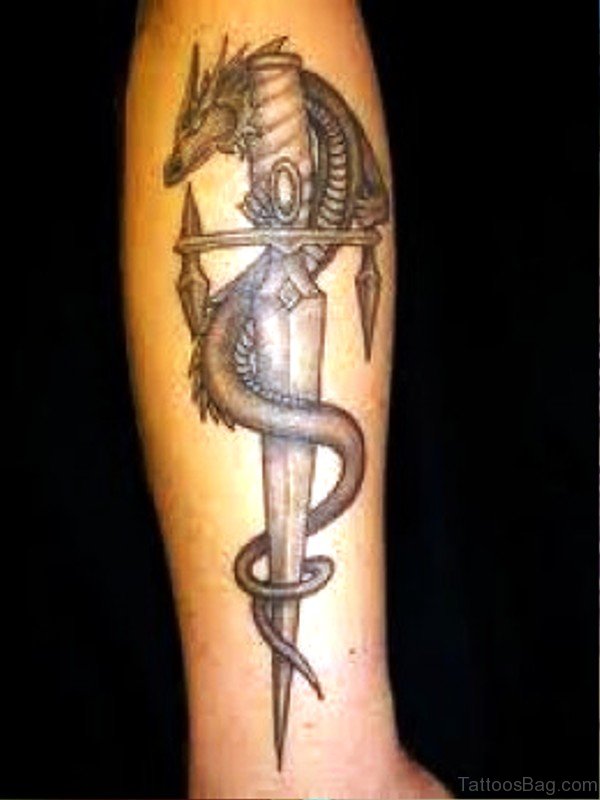 Photo Of Dragon And Dagger Tattoo