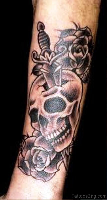 Pic Of Skull With Dagger Tattoo On Arm