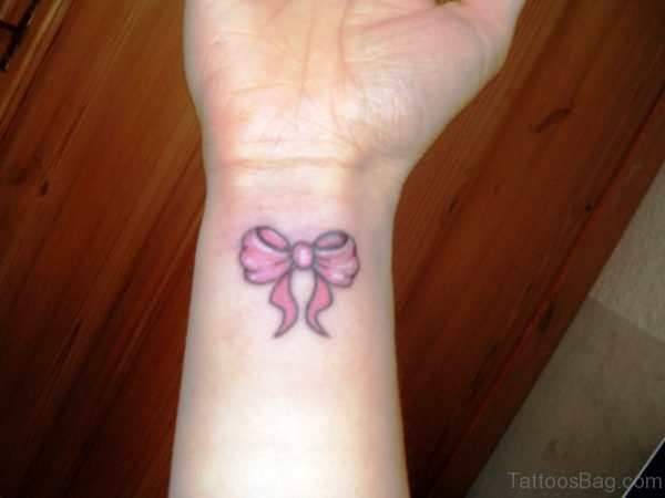 Pink Bow Tattoo On Wrist