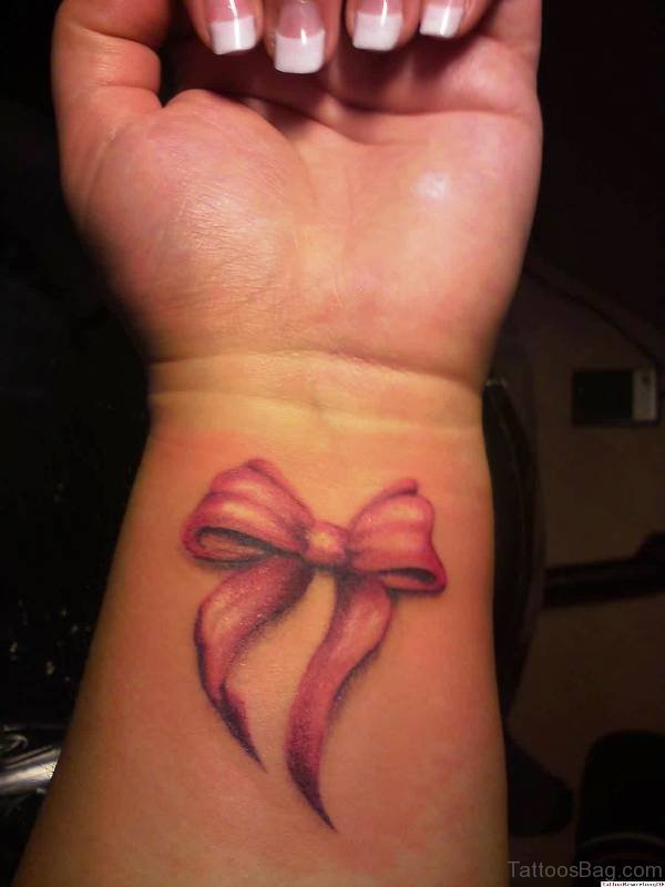 Pink Ribbon Bow Tattoo On Wrist