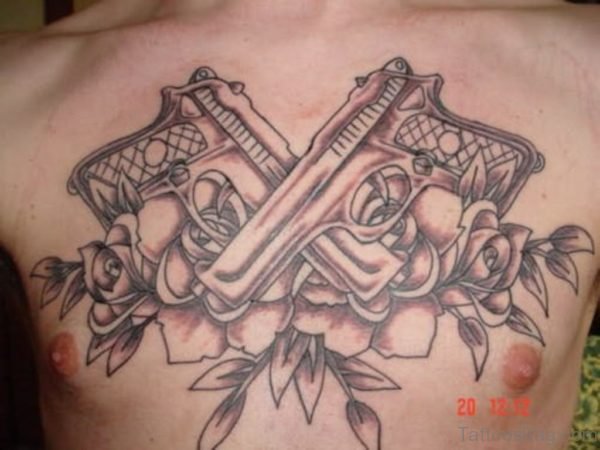 Pistol And Rose Tattoo On Chest