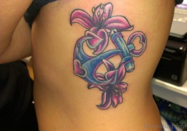 Purple Flower And Anchor Tattoo