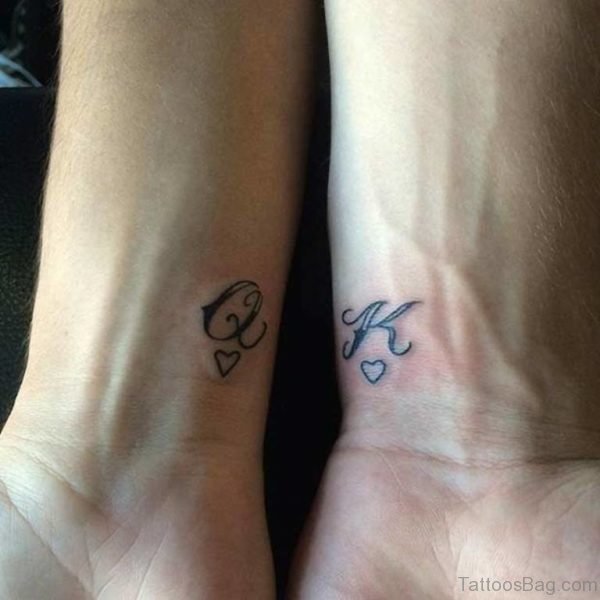 Q And K Tattoo On Wrist