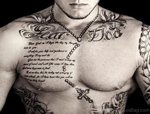Quote With Rosary Cross Tattoo On Man Chest