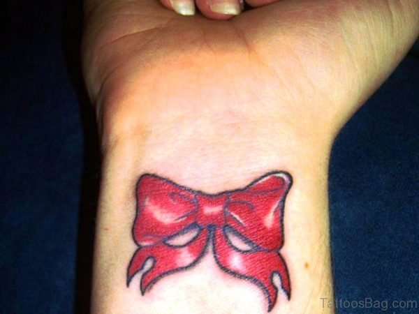 Red Bow Tattoo On Wrist