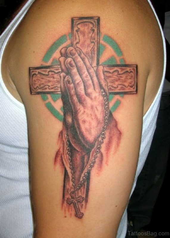 Red Ink 3D Cross Tattoo With Pyaying Hands On Shoulder