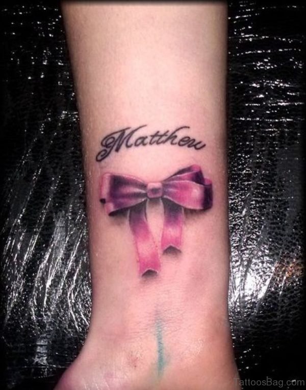 Ribbon And Name Wrist Tattoo