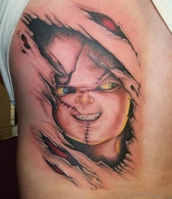 Ripped Skin Chucky Tattoo On Side Rib