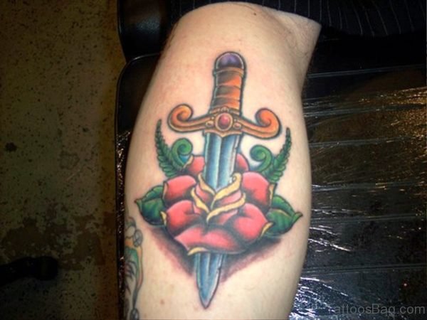 Rose With Dagger Tattoo On Arm