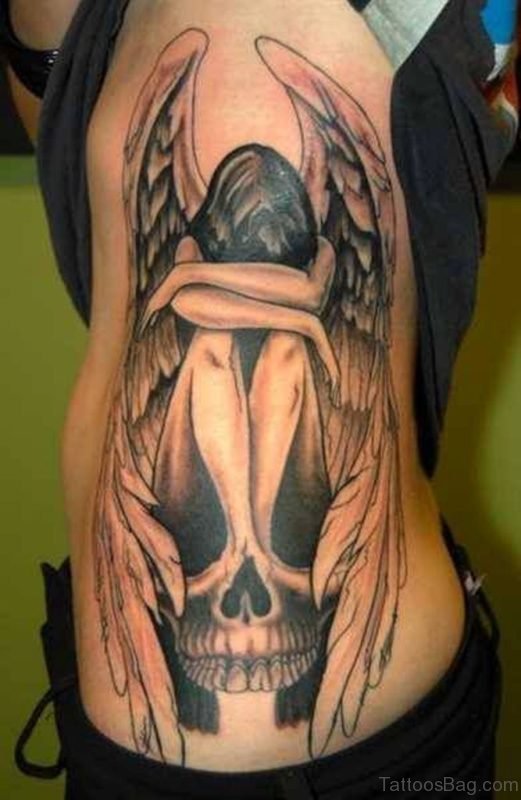 Sad Angel Tattoo On Rib