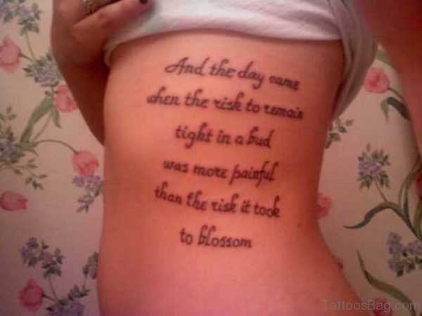 Script Tattoo On Rib