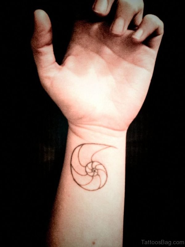 Simple Seashell Tattoo On Wrist