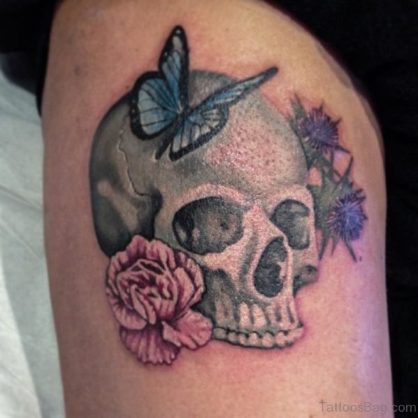 Skull And Butterfly Tattoo On Thigh