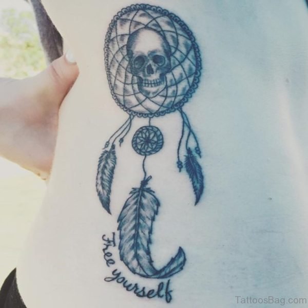 Skull And Dreamcatcher Tattoo On Rib