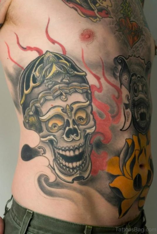 Skull Mask And Flames Tattoo Designs On Rib Side