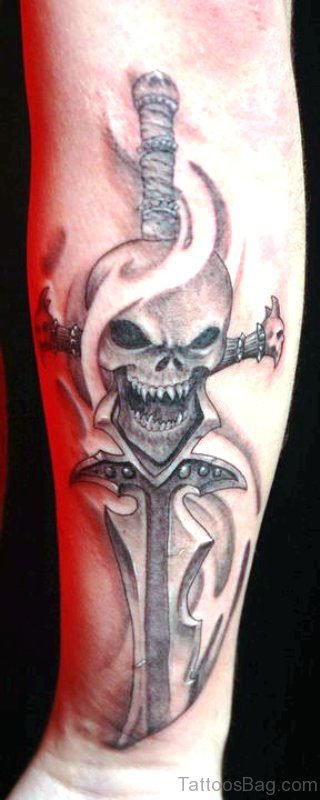 Skull With Dagger Tattoo On Arm