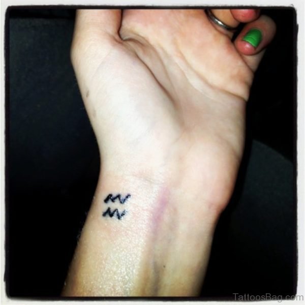 Small Aquarius Wrist Tattoo