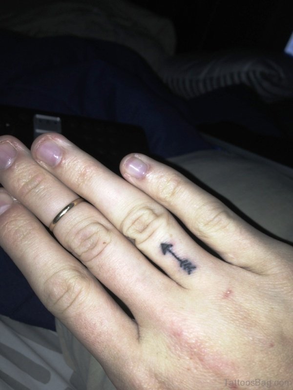 Small Arrow Tattoo On Finger