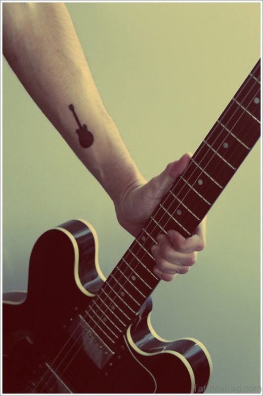 Small Black Guitar Tattoo On Wrist