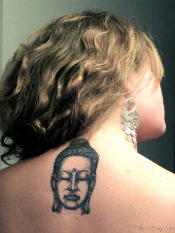 Small Buddha Face Tattoo On Upper Back