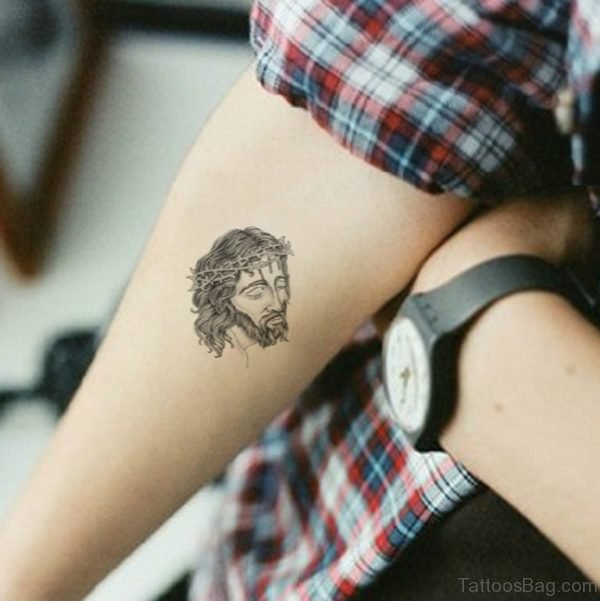 Small Jesus Face Tattoo On Arm