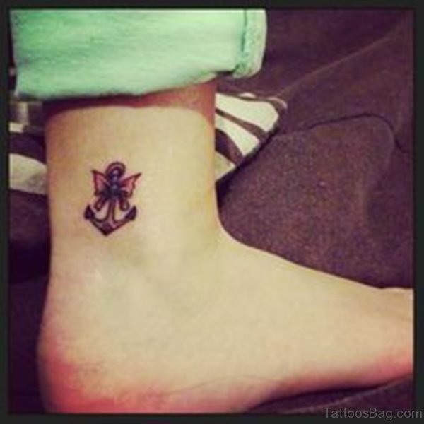 Small anchor and Bow Tattoo On Ankle
