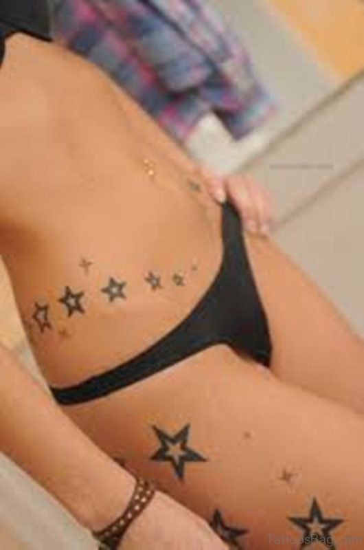 Star Tattoo On Rib And Hip
