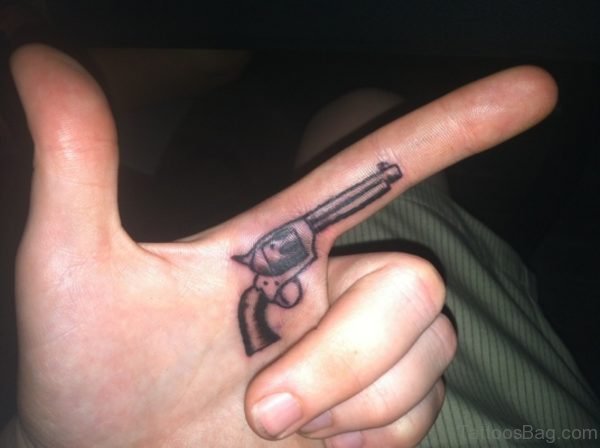 Stunning Gun Tattoo On Finger