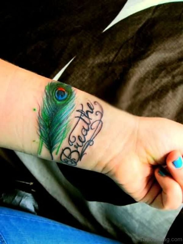 Stunning Peacock Feather Wrist Tattoo