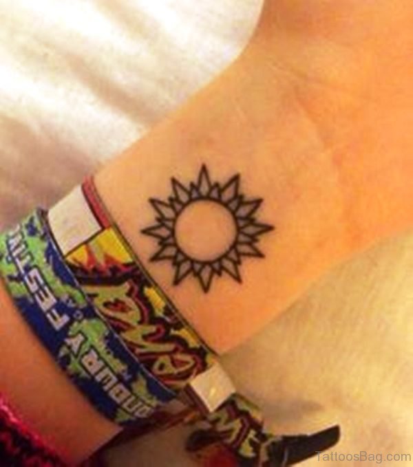 Stunning Sun Tattoo On Wrist