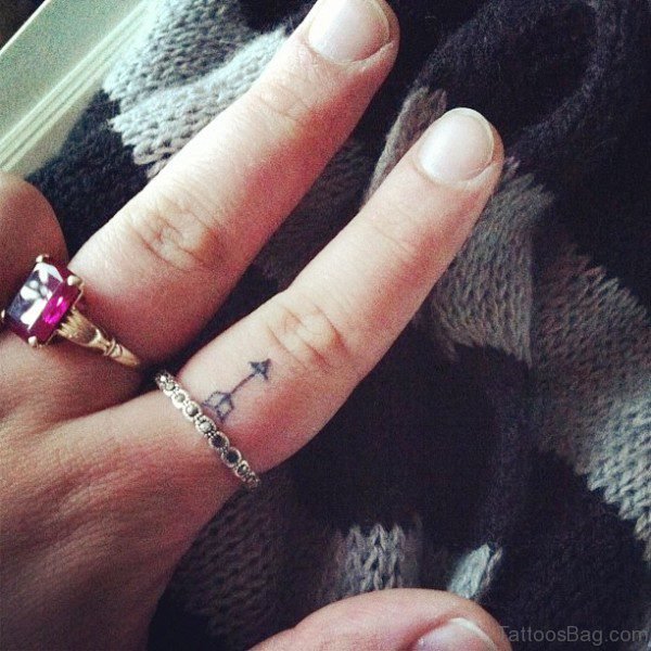 Sweet Arrow Tattoo On Finger