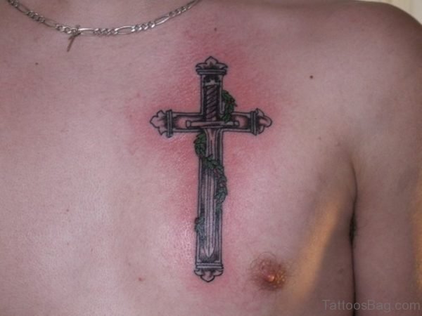 Sword In The Middle Of Cross Tattoo On Chest