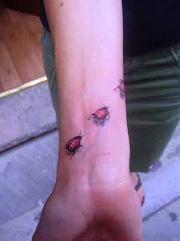 Three Ladybird Wrist Tattoo