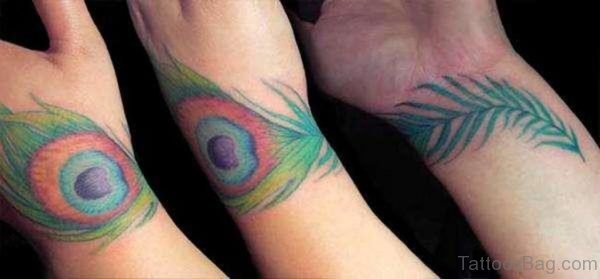 Three Peacock Feather Wrist Tattoo