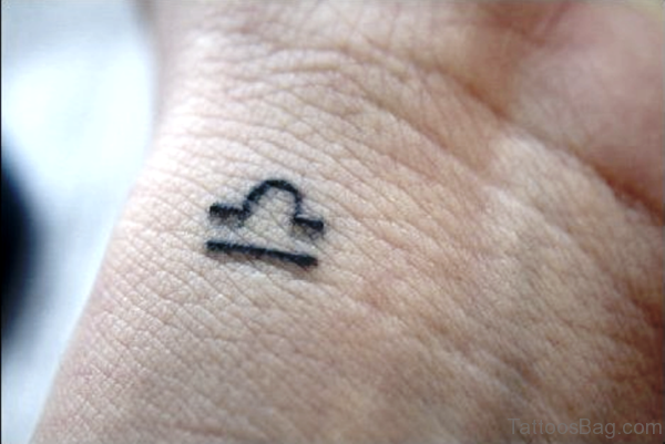 Tiny Libra Wrist Tattoo