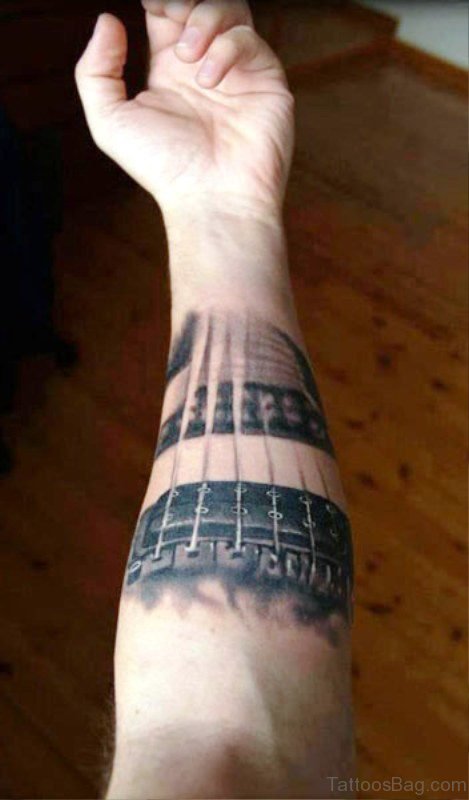 Tremendous Grey Guitar Tattoo On Forearm