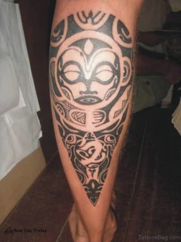 Tribal Mask Tattoo On Lower Leg