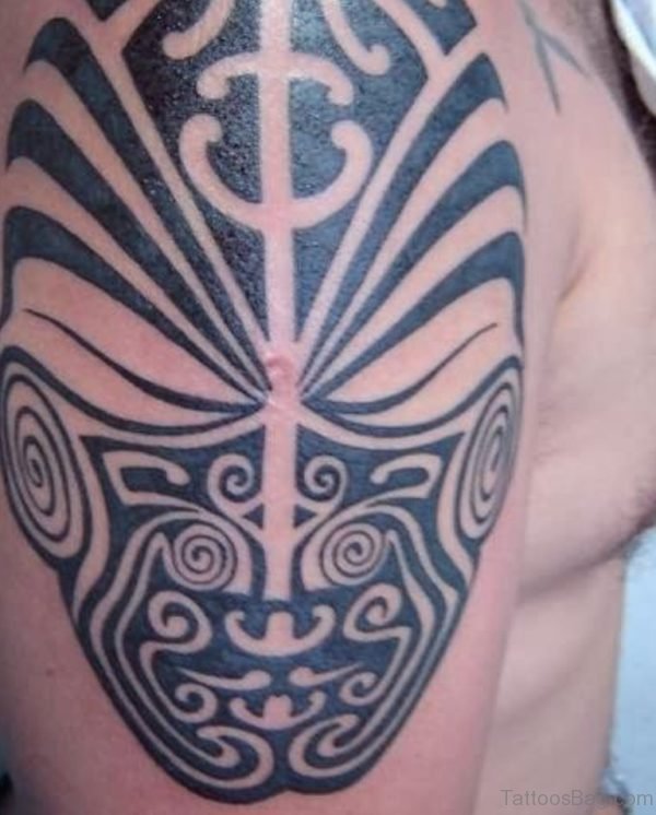 Tribal Mask Tattoo On Shoulder 