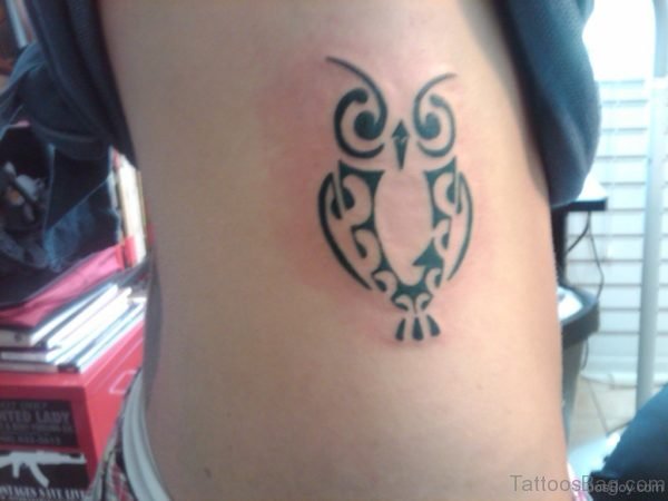 Tribal Owl Tattoo On Rib