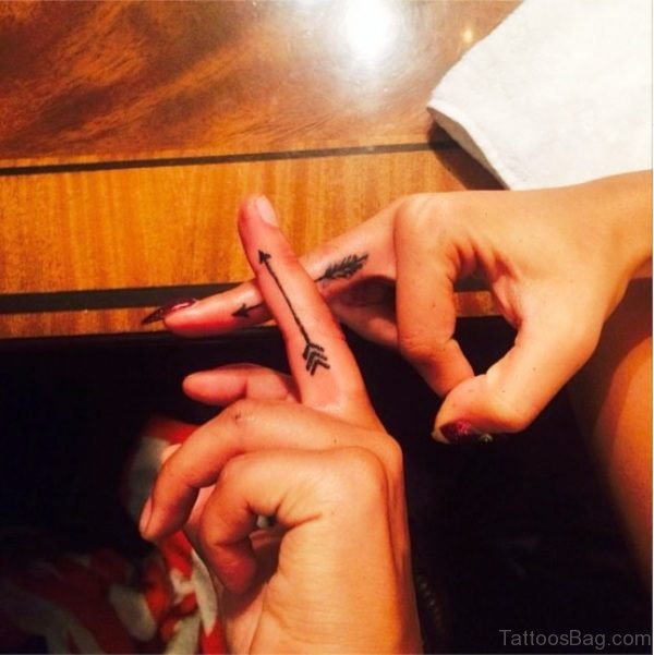 Two Arrows Tattoos On Fingers