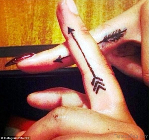 Two Crossing Arrow Tattoo On Finger